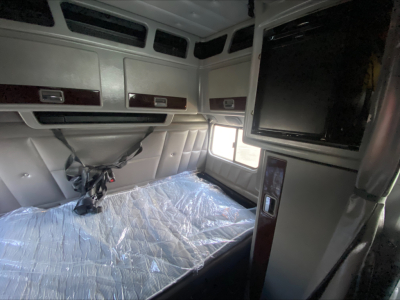 Peterbilt 389 sleeper cab interior with berth and overhead storage