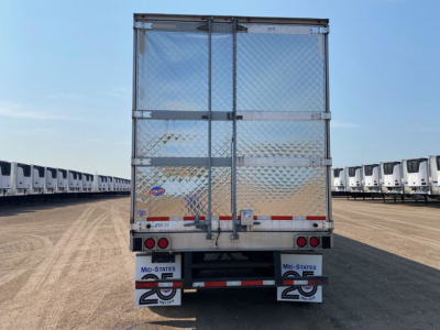 Rear view of a 2021 refrigerated trailer with diamond plate doors, rear bumper, and Maryland States 26 stickers; text shows reflective tape, taillights, and a stock number plate.
