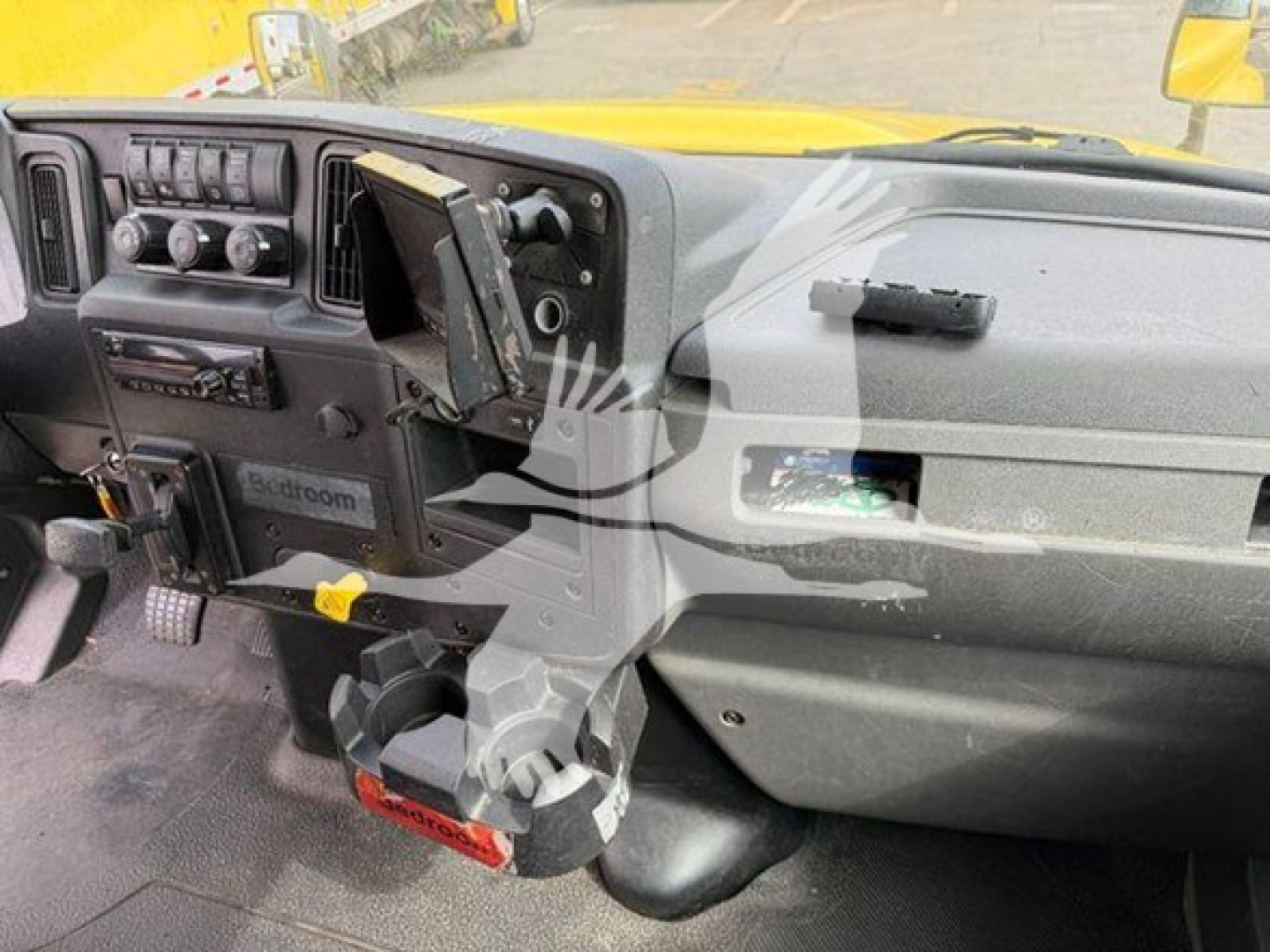 Interior dashboard of a 2020 International MV moving van showing steering column, dashboard gauges, and center console.