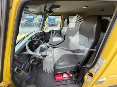 Interior view of a 2020 International moving van cab showing driver and passenger seats and dashboard.