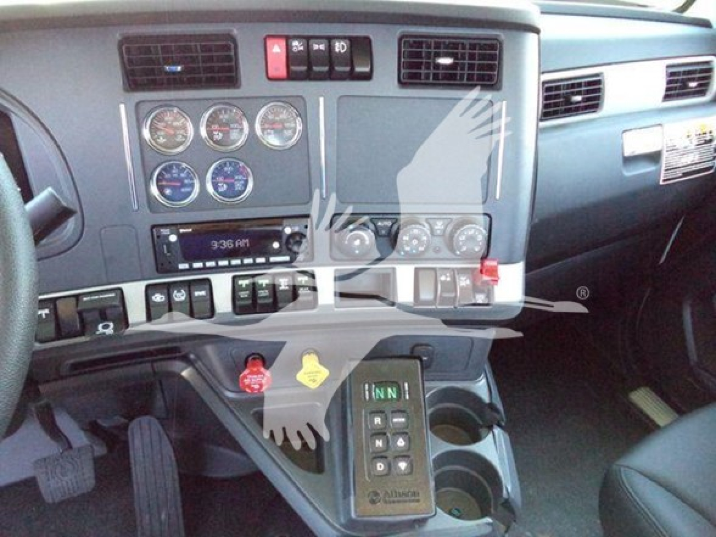 Kenworth T880 dashboard and center console showing gauges, climate controls, and gear selector in the cab.