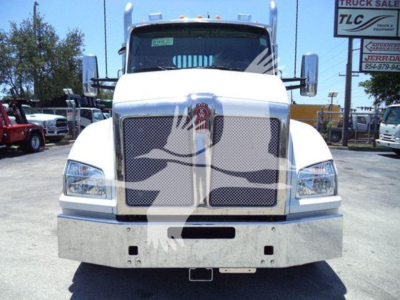 Kenworth T880 rollback truck front view showing grille, bumper, and emblem; VIN 1NKZL40XXTJ211612 visible in listing; large chrome bumper and headlights.
