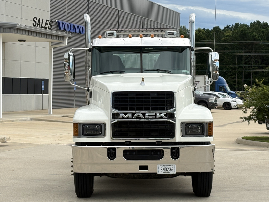 Mack PI64T conventional daycab truck front view showing grille, bumper, and headlights.