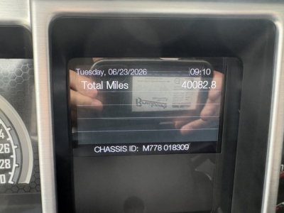 Dashboard display showing Total Miles 40082.8, Tuesday 06/23/2026, Chassis ID M778 018309, Mack PI64T information panel.