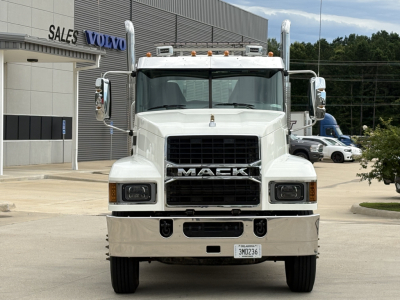 Mack PI64T conventional daycab truck front view showing grille, bumper, and headlights.