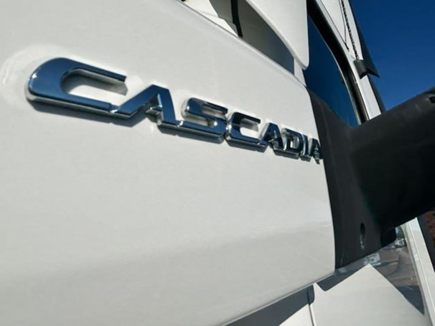 Cascadia badge on a Freightliner Cascadia 126 truck showing chrome lettering close-up