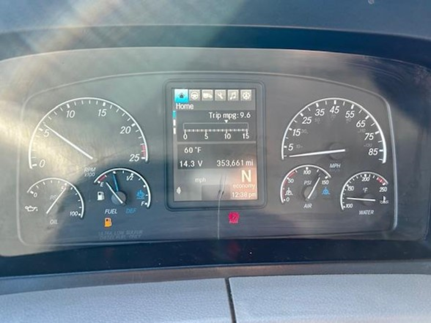 Dashboard of a Freightliner Cascadia 126 in-service showing instrument cluster with speedometer, tachometer, fuel gauge, and a central digital display.