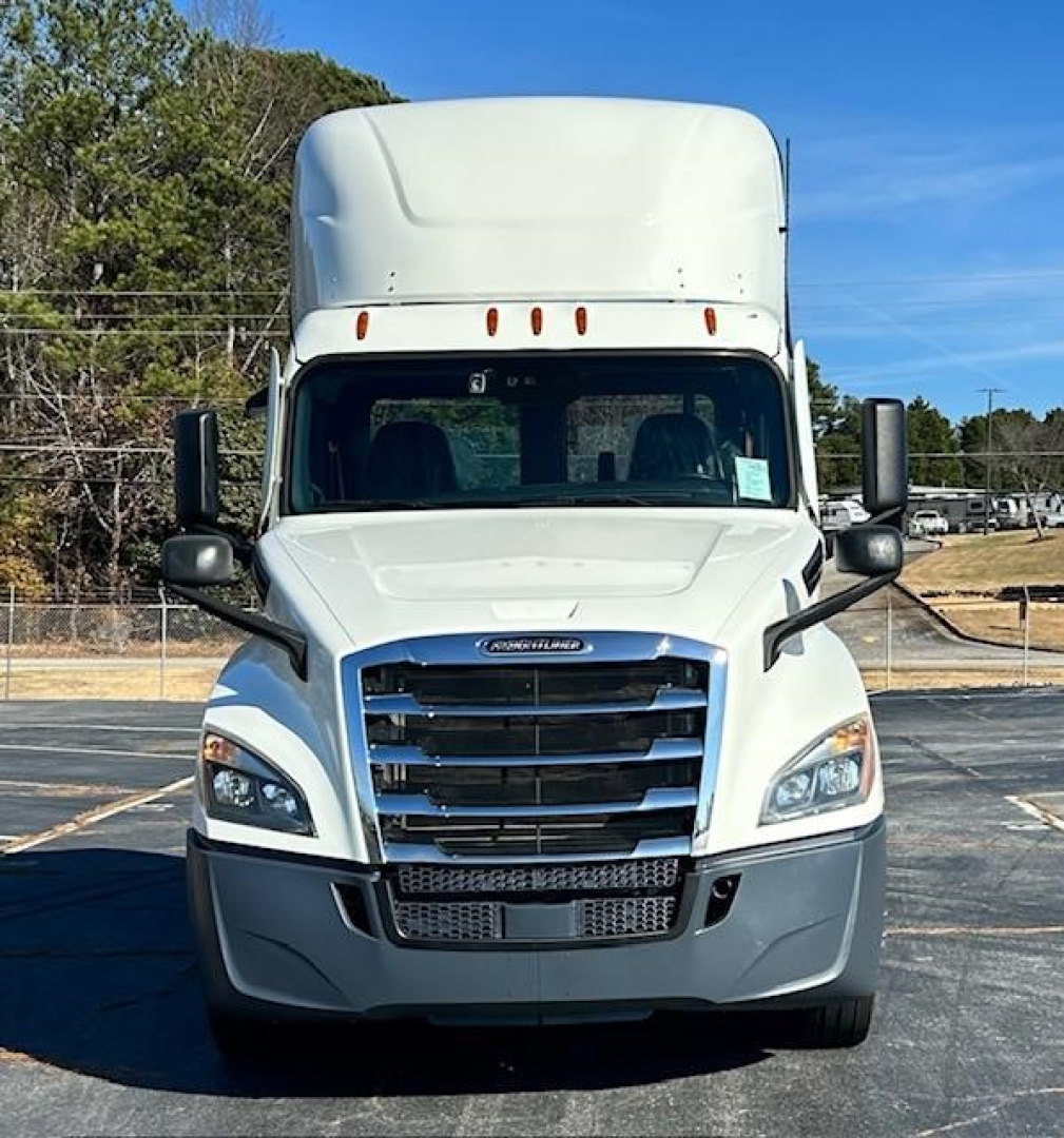Freightliner Cascadia 126 day cab front view showing grille, headlights, bumper, mirrors, and air deflector on hood.