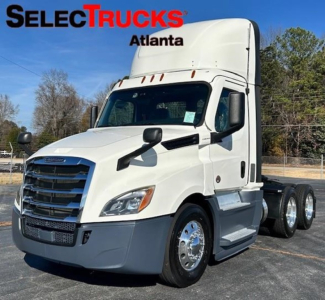 Freightliner Cascadia 126 tractor in white, side view showing cab and front grille, SelectTrucks Atlanta watermark.