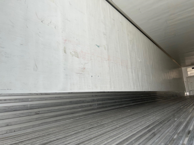 Trailer interior showing corrugated metallic floor and side walls of a 2018 Utility 3000R reefer trailer.