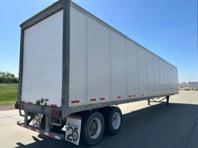 Trailer side and rear showing a 2014 Wabash box trailer with dual rear wheels and ladder ramps; VIN 1JJV532D2EL812521 visible.