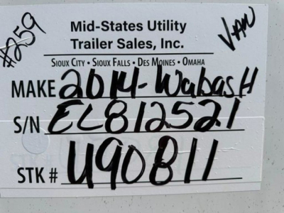 Trailer tag showing Mid-States Utility Trailer Sales label with handwritten VIN and stock number. Text includes MAKE Wabash, S/N EL812521, STK # U90811.