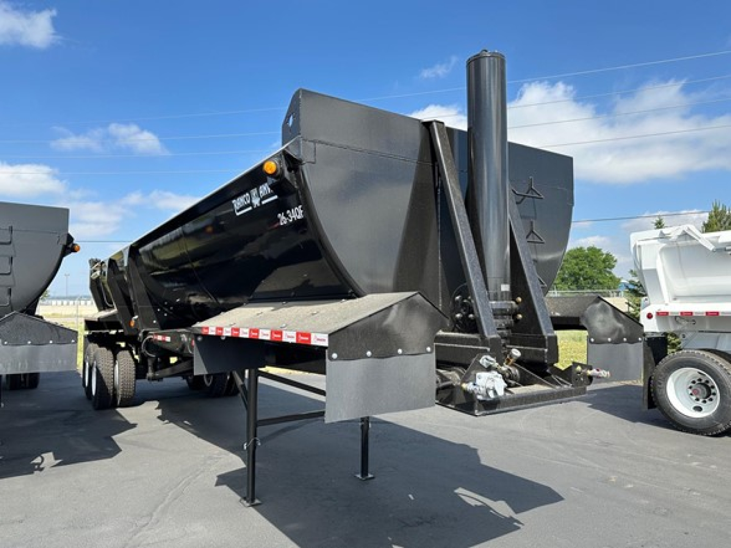 2025 Ranco Quarter Frame End Dump trailer showing black dump body and frame with front hitch and support leg.