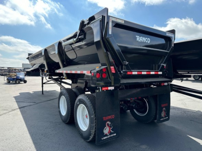 Ranco quarter-frame end dump trailer showing rear and side with black paint and white wheels, branding 'RANCO' on tailgate, dual rear tires, mud flaps with Ranco logo.