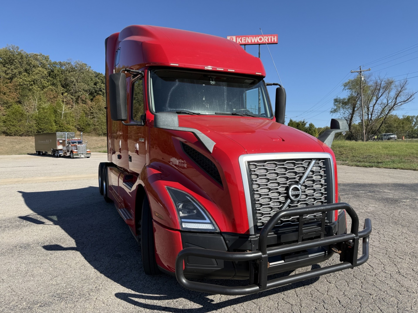 Volvo VNL64T760 sleeper truck front view showing large grille and front bumper guard.