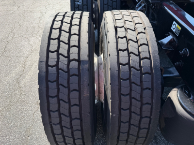 Kenworth T680 wheel pair/view showing dual rear tires with tread pattern