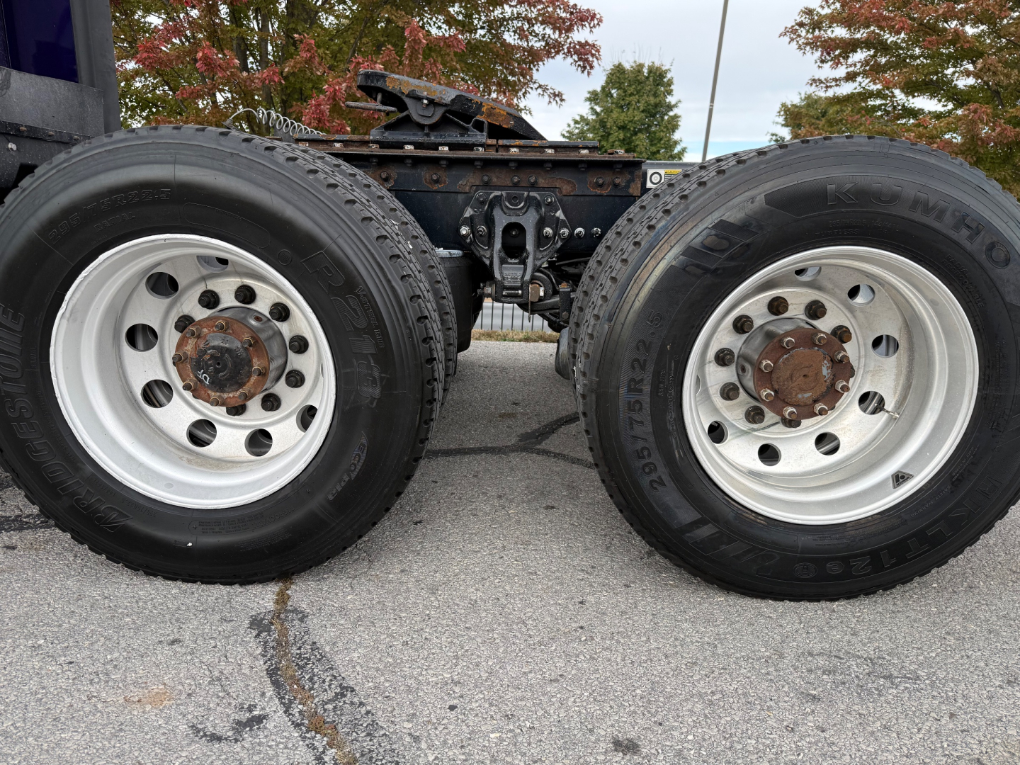 Kenworth T680 rear wheels and chassis showing dual tires and hub assemblies.