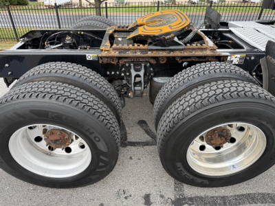 Kenworth T680 chassis showing dual rear axles with tires and fifth wheel coupling visible.
