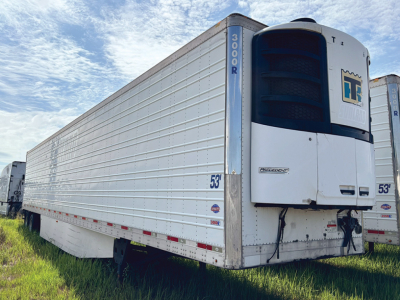 Utility 3000R trailer with reefer unit, side panels, and 53' length; front doors closed with cooling unit visible.