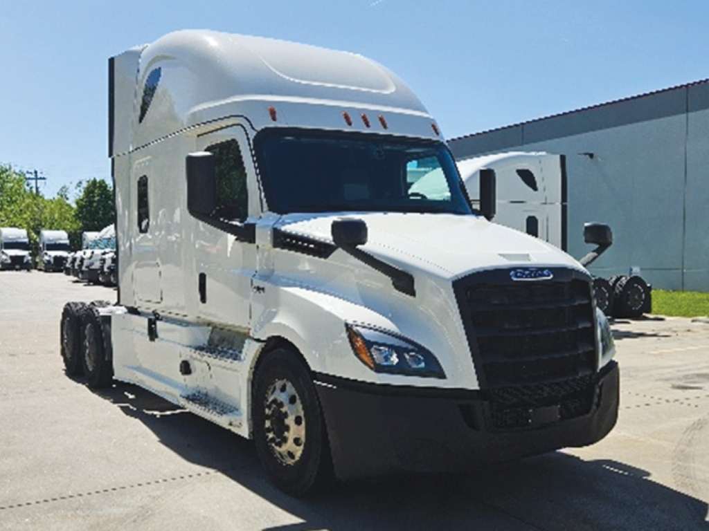Truck cab showing 2020 Freightliner Cascadia126, white sleeper cab, black grille, side mirrors, and dual rear wheels.