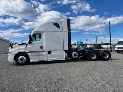 Freightliner CA-126 tractor-trailer cab and chassis side profile with sleeper, white exterior, undercarriage and fifth wheel visible.