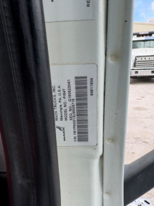 Mack Trucks label on door jamb showing model and VIN details for a 2020 Mack PI64T conventional daycab.