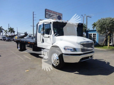 Truck image showing a white 2027 Freightliner M2 106 rollback chassis with flatbed, front grille, and side mirrors.