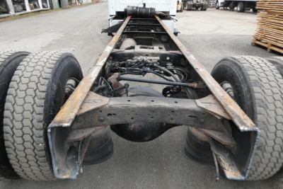  Freightliner M2-106 chassis frame and dual rear axles showing undercarriage and suspension. 
