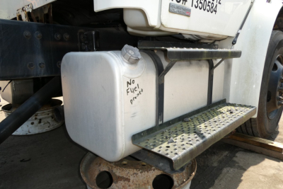Freightliner M2-106 fuel tank and side-step with no fuel markings visible.