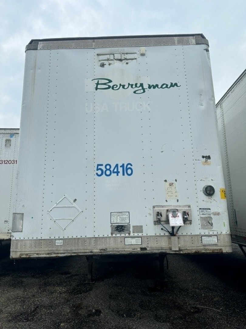 Rear view of a Berryman Great Dane dry van trailer showing the number 58416 and various maintenance stickers.