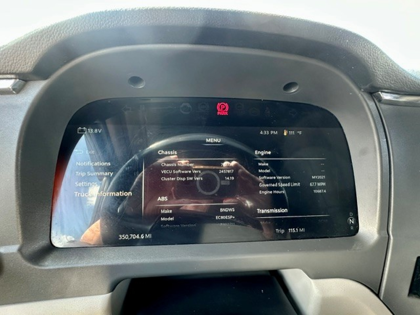 Peterbilt 579 truck dashboard display screen showing vehicle information and trip data.