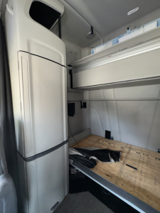 Peterbilt 579 sleeper cab interior with raised bunk area and storage cabinet