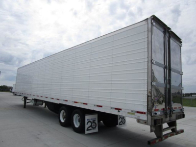 Trailer showing a 2019 utility reefer with white side panels and double rear doors, side-view of a refrigerated trailer with tandems and stock numbers visible.
