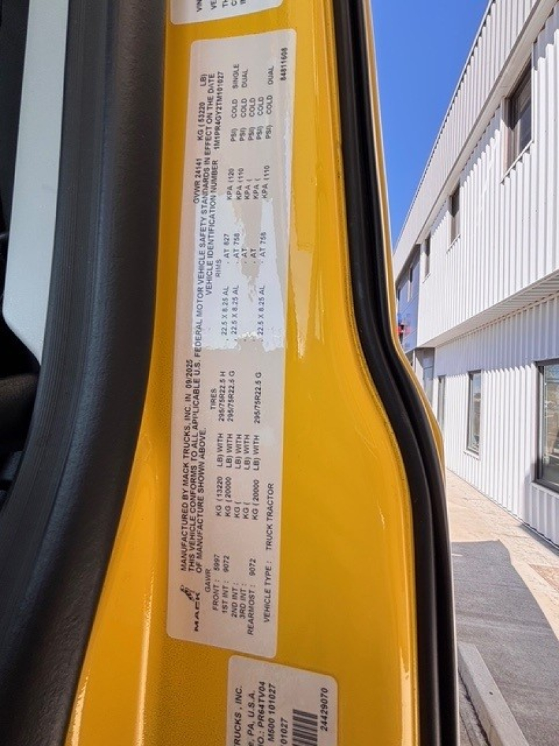Truck door jamb label showing vehicle specifications and weights for a 2026 Mack PR64T76H conventional sleeper, with VIN 1M1PR4GY2TM101027 and stock number 71324.