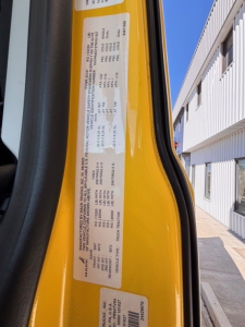 Truck door jamb label showing vehicle specifications and weights for a 2026 Mack PR64T76H conventional sleeper, with VIN 1M1PR4GY2TM101027 and stock number 71324.