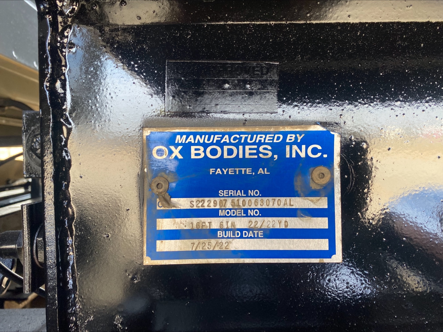 Manufactured by OX BODIES, INC. plate on dark blue paint with serial and model numbers; Build date 7/25/82.