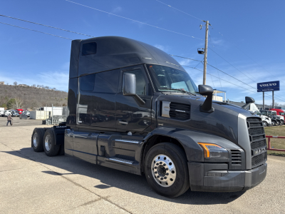 Mack PR64T76H conventional sleeper tractor in black, side view showing cab, front grille, and wheel set.