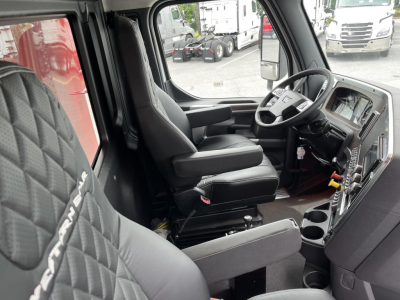 Western Star 47X truck cab interior showing driver's seat and dashboard with steering wheel and control area.