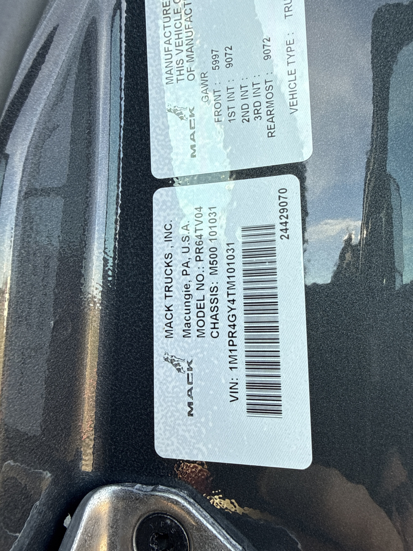 Mack PR64T76H truck window sticker labels showing manufacture data, VIN, and chassis information.