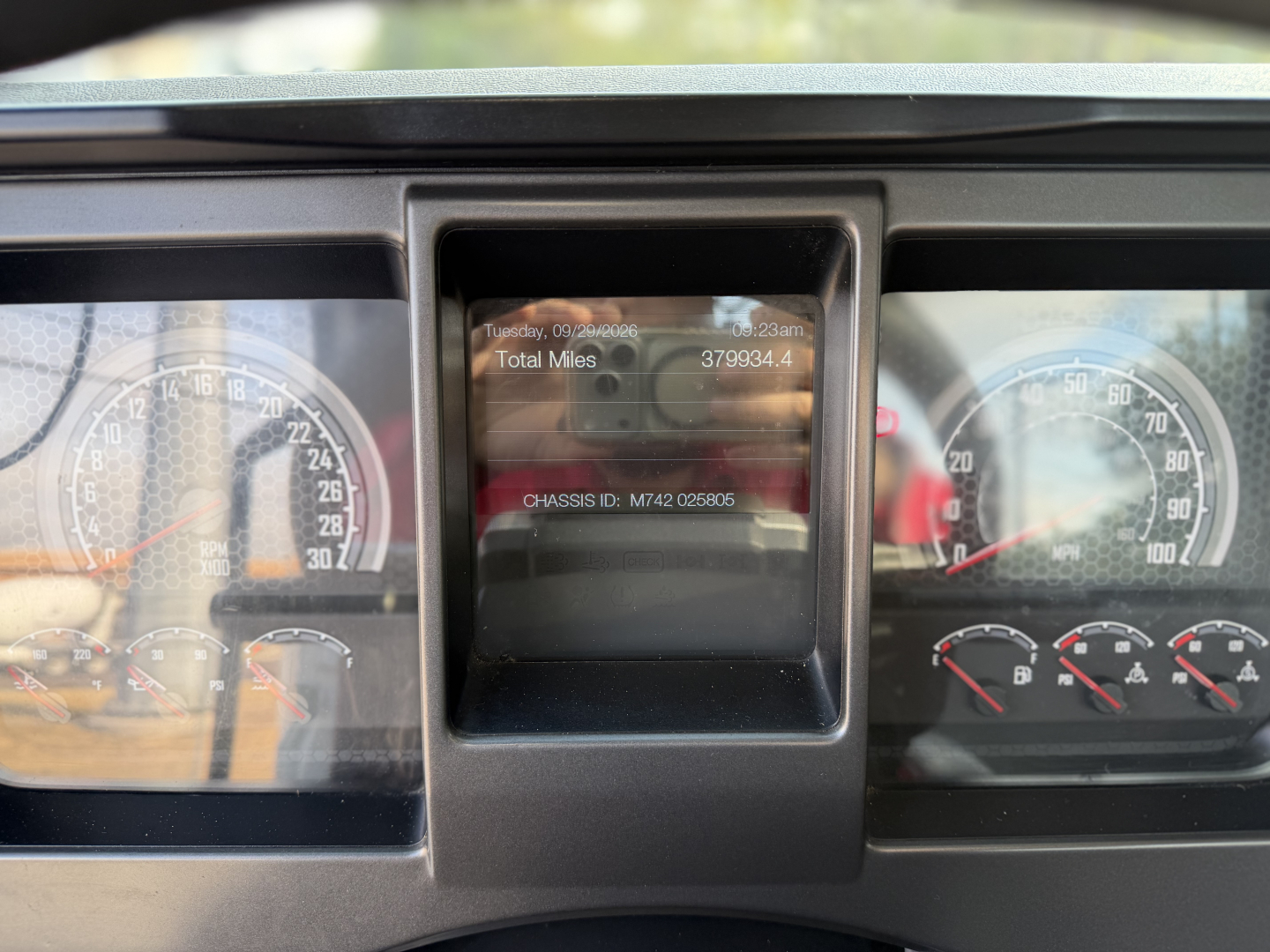 Dashboard view showing instrument cluster and center display of a Mack ANTHEM 64T truck; visible gauges and a digital odometer area.