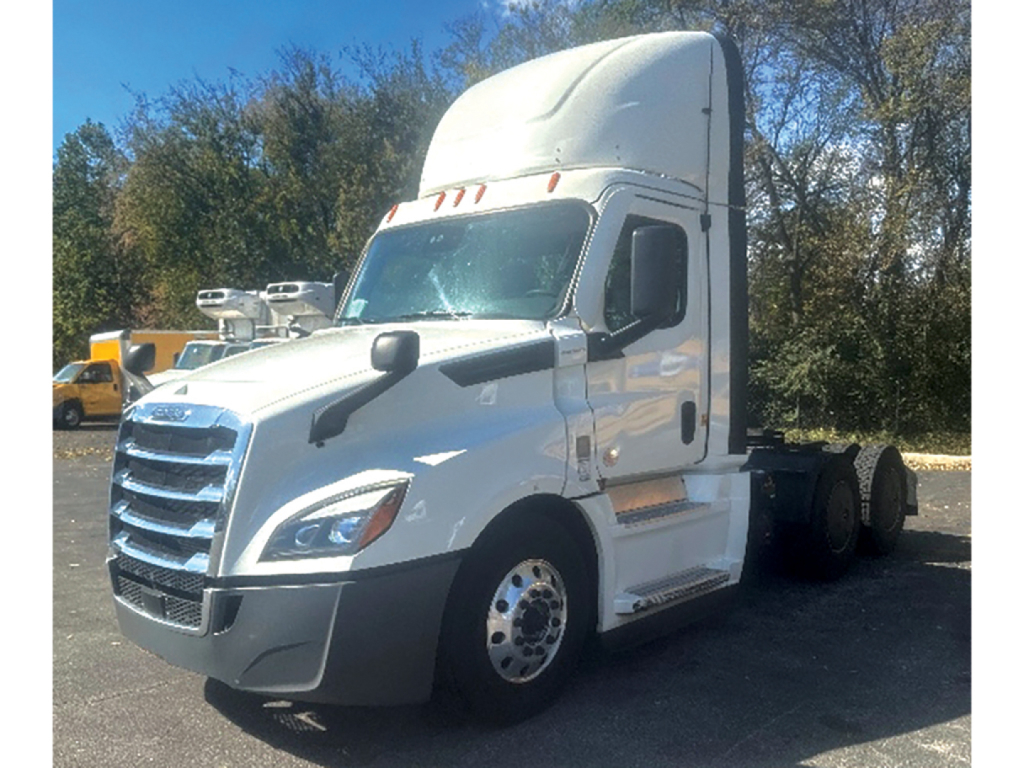 Freightliner Cascadia126 cab tractor in white, side view showing sleeper bunk, front grille, and chrome wheels.