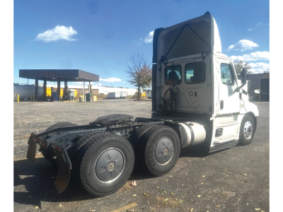 Freightliner Cascadia126 tractor cab and rear wheels with fifth wheel area visible.