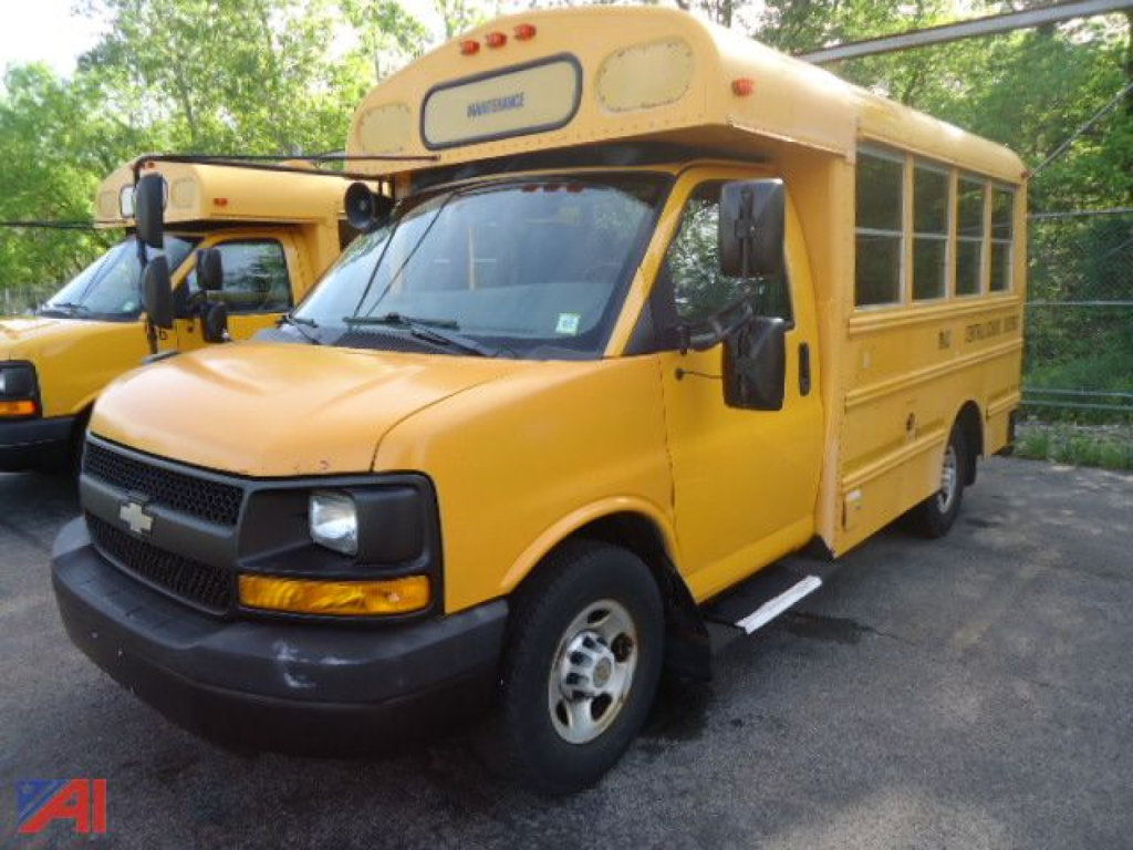 School bus showing front and side view with yellow body and black bumper; Chevrolet emblem on grille.