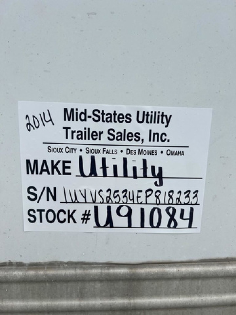 Label on van showing 2014 Mid-States Utility Trailer Sales stock tag with S/N and STOCK # U91084.