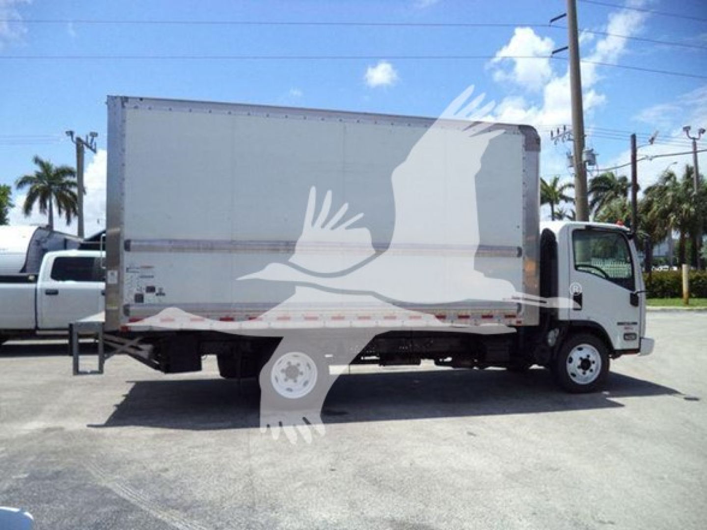 Box truck side view showing Isuzu NPR with cargo box