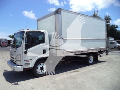 Isuzu NPR box truck showing side view with cargo box and cab; white body, black tires, clear sky.