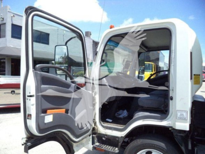 Isuzu NPR box truck cab interior with driver door open showing gray dashboard, steering wheel, and seating area.