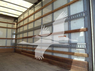 Truck cargo area with sidewall ribs and interior; no visible text readable.