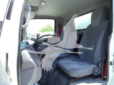 Isuzu NPR truck cab interior showing driver's seat and passenger seat with steering wheel and dashboard visible.