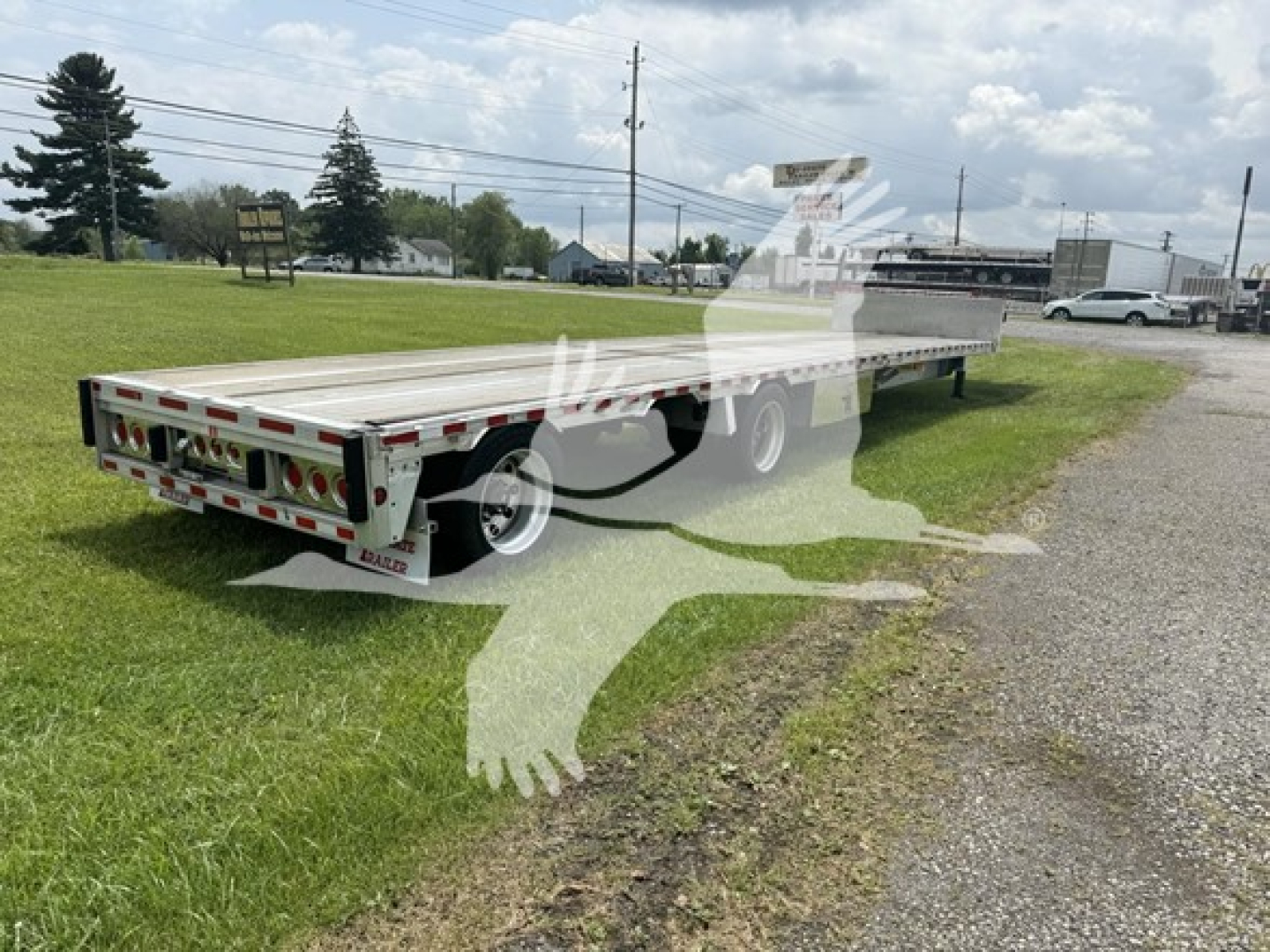 Trailer showing 2019 Reitnouer 48x102 dropdeck with Ras, flatbed trailer in outdoor lot.